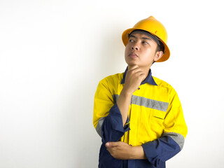 Thinking Asian young worker is thinking seriously with gesture on white background