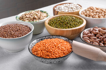 Mixed pulses for healthy and balanced diet in the bowls on the table