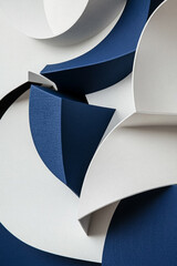 Abstract composition of curved blue and white textured shapes, creating a modern and elegant design with depth and movement