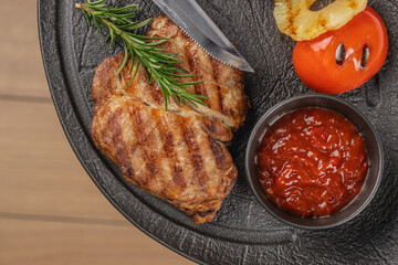 grilled pork steak with grilled vegetables. top view. copy space