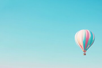 Naklejka premium colorful hot air balloon floats serenely against clear blue sky with expansive copy space above capturing tranquility