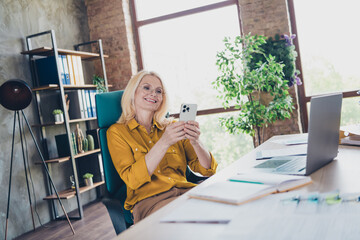 Photo of sweet charming lady assistant wear shirt chatting modern gadget indoors workplace...