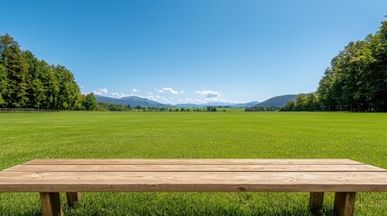 Empty school sports ground Concept, Untouched Sports Ground with Bleachers Under Clear Blue Sky and Lush Green Grass in Scenic Landscape