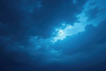 Fototapeta premium Majestic blue against a backdrop of dense dark cloudy, majestic, nature, vast