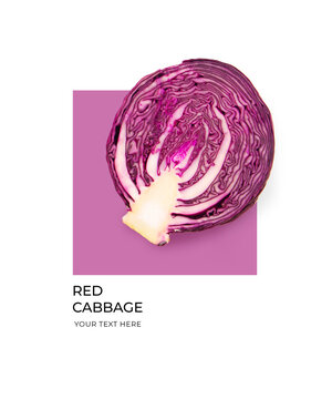 Creative layout made of red cabbage on the purple and white background. Flat lay. Food concept. Lemon on white background.