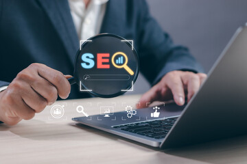 SEO search engine optimization technology concept and web search on internet, man hold magnifying glass show process trying to increase quality traffic or digital marketing search ranking strategy