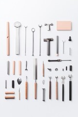 neatly arranged set of firefighter tools on plain unadorned background