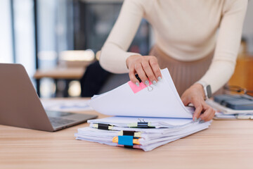 Business Business Documents, woman hands working in Stacks of paper files for searching and...