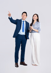 Full body image of young asian business couple posing on white background