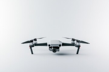 Fototapeta premium sleek modern drone with four rotors placed on pristine white backdrop engines slightly angled as if to suggest movement