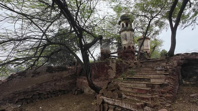 Fading Legacy: An Abandoned Well and Stairway Lost in Time