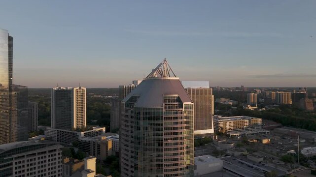 Stunning cinematic aerial views of the Buckhead, GA skyline at sunset&mdash;highlighting modern architecture, golden hour light, and urban elegance. Ideal for real estate, branding, or tourism.