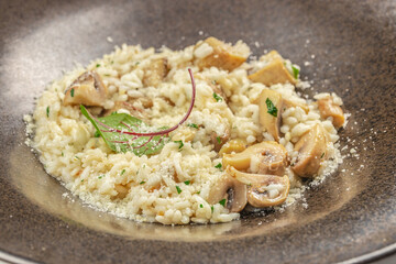risotto with brown champignon mushrooms and white wine. dish of Italian cuisine