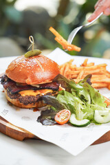 cheese burger with fries & vegetables