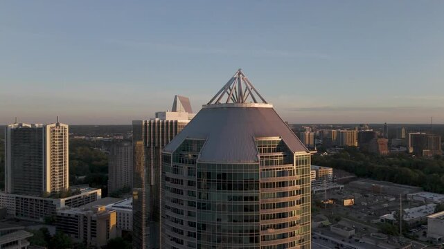 Stunning cinematic aerial views of the Buckhead, GA skyline at sunset&mdash;highlighting modern architecture, golden hour light, and urban elegance. Ideal for real estate, branding, or tourism.
