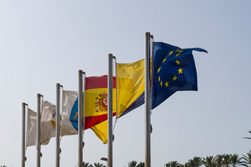 Some flags waving in the wind, symbols of unity, solidarity and harmony among the peoples of Europe