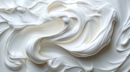 Obraz premium Creamy white cosmetic product texture forms elegant swirls and strokes, creating a luxurious backdrop ideal for beauty and skincare marketing.