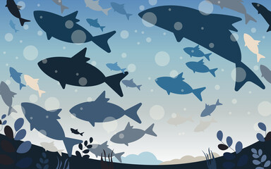 Marine life of different species of fish swimming in deep water, bottom view. 