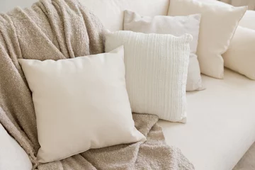 Decorative pillows on a bed © aprilante