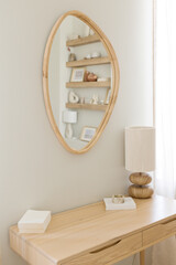 Lamp and mirror on wooden table