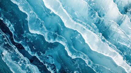 Obraz premium Abstract aerial view of glacial ice, showing textured blue and white patterns.
