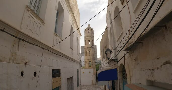 Narrow alley street view of historic Zaouia Zakkak mosque in Sousse, Tunisia