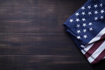 minimalistic stock photo of folded american flag placed on dark wooden table symbolizing remembrance and honor