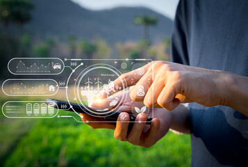 Smart Agriculture, digital interface in hand, monitoring data, enhancing farm management, technology in farming, ESG Environmental, social and corporate governance concept.