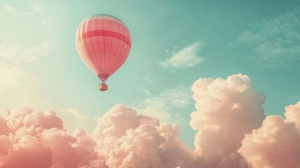 Fototapeta premium A dreamy pastel hot air balloon glides gracefully through a soft sky filled with fluffy clouds in shades of pink, light blue, and yellow