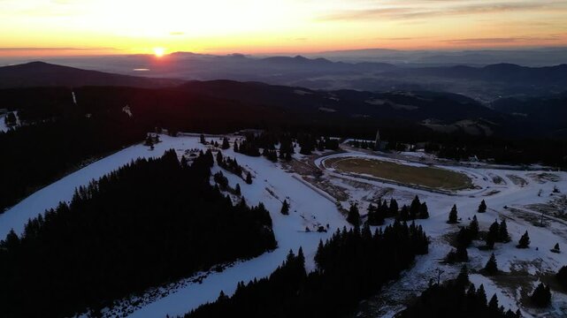 Aerial drone morning view of ski resort Rogla at sunrise dawn. Panoramic winter shot of Ski center Rogla, Slovenia
