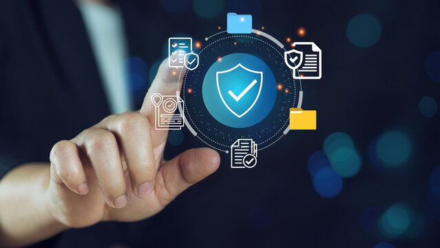 Hand touching a digital padlock icon on a virtual screen a cyber security and data protection.Cybersecurity concept with digital shield and data protection icons.
