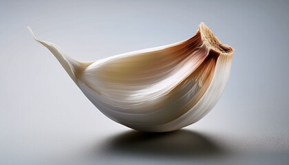 Fresh Garlic Clove: A close-up, artful shot of a single garlic clove, showcasing its pristine white flesh and delicate texture, hinting at the pungent flavors within.