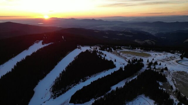 Aerial drone morning view of ski resort Rogla at sunrise dawn. Panoramic winter shot of Ski center Rogla, Slovenia