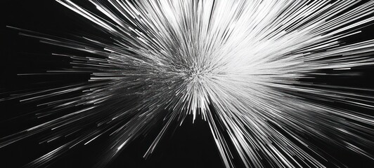 Abstract grayscale burst of light radiating outwards from central point.