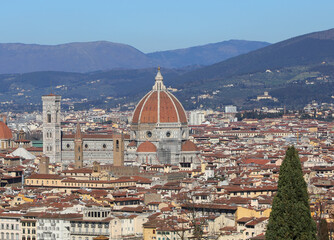 Fototapeta premium giottos bell tower and the grand dome by famous architect brunelleschi in the duomo of the city of florence in central italy in europe