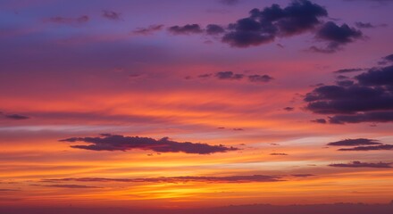 Fototapeta premium Sunset sky with colorful clouds in orange and purple hues