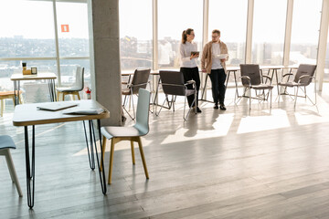 Office workers discussing indoors the job