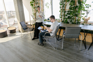 Business meeting or two people working in office