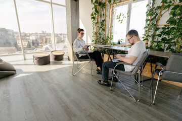 Two office workers working together 