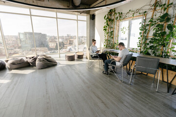 Two office workers working together 
