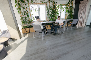 Two office workers working together 