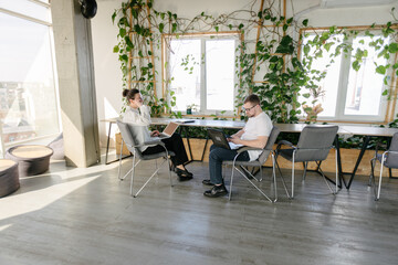 Two office workers working together 
