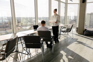 Two office workers working together 