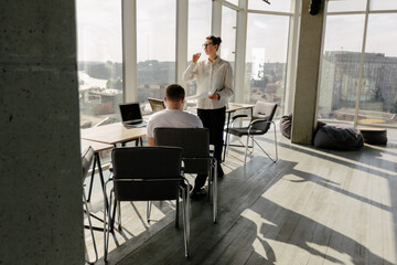 Two office workers working together 