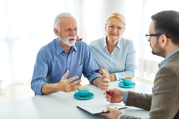 meeting agreement investment couple contract advice retirement consultation house finance senior...
