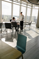 Two office workers working together 