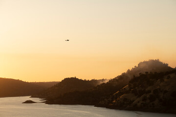 Helicopters Battling a Wildfire at Golden Hour