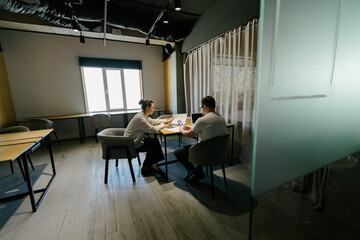 Business meeting or two people working in office