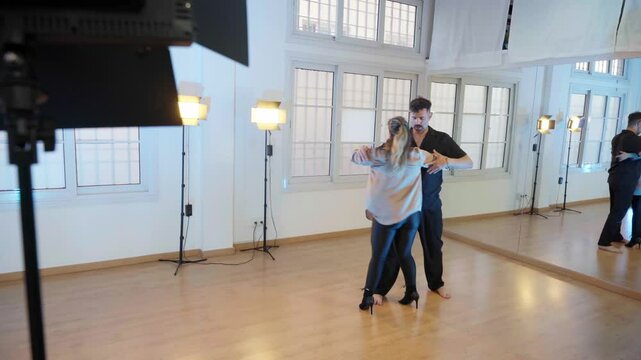 Professional bachata dancers performing in dance studio