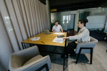 Business meeting or two people working in office
